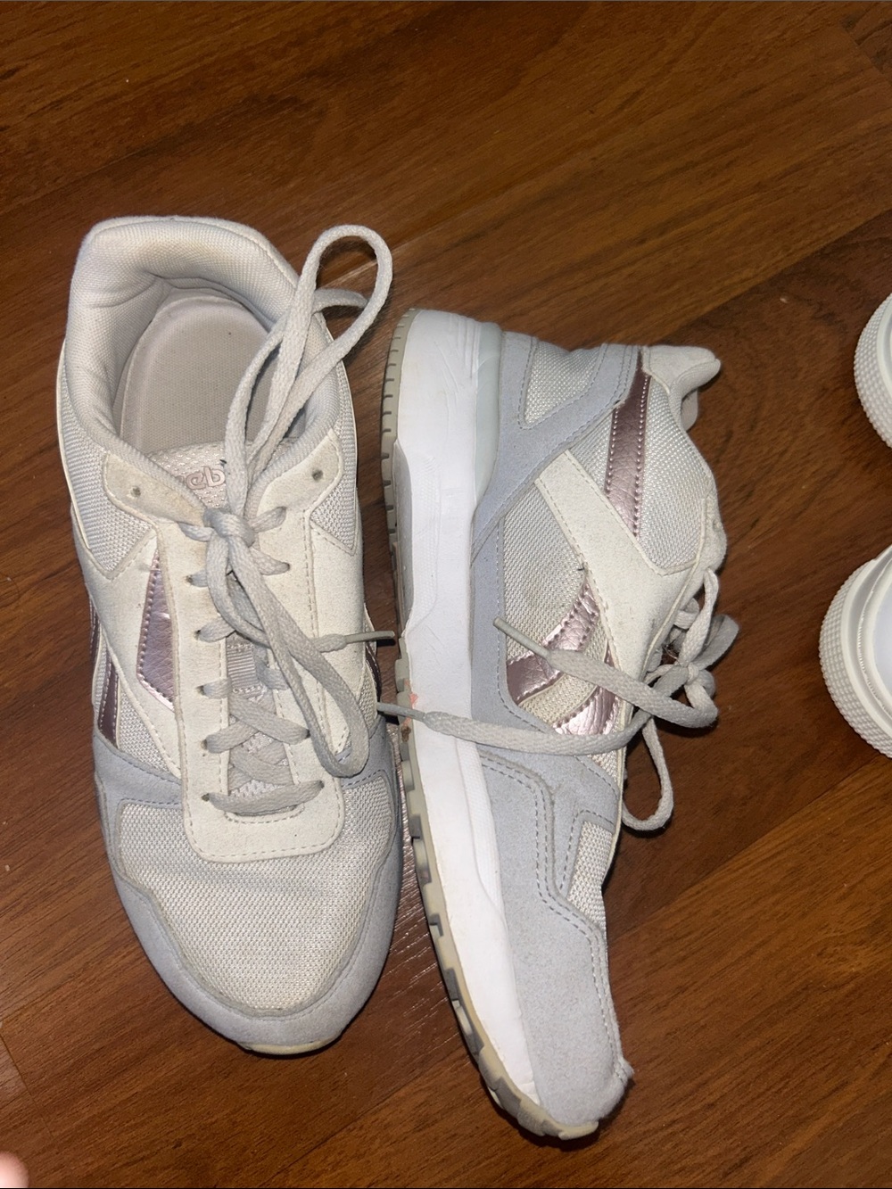 Reebok Women’s White Sneakers with Rose Metallic Accents